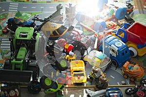 Lots of toys on a carpet in a kid room