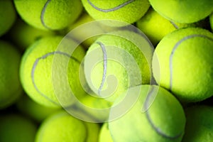 Lots of vibrant tennis yellow balls