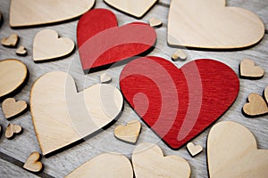 Lots of wooden hearts on the table