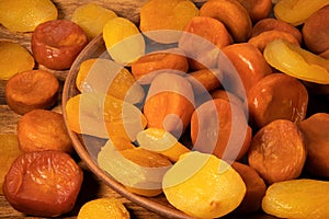 Lots of yellow and orange dried apricots fruits. View from above