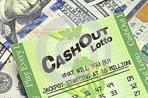 Lottery Ticket and Cash Close Up
