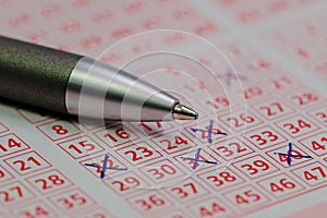 Lottery ticket with ticked winning numbers