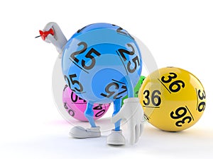 Lotto ball character holding thumbtack