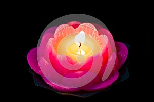 Lotus candle light illuminate a dark surrounding