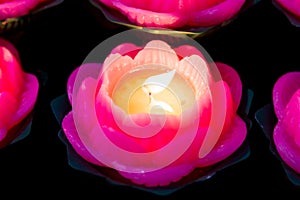 Lotus candle light illuminate a dark surrounding