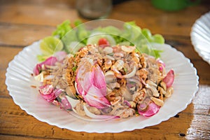 Lotus leaf salad with pork on the table
