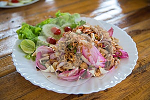 Lotus leaf salad with pork on the table