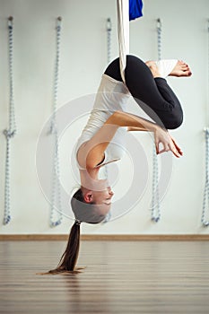 Lotus pose in aero anti gravity yoga. Aerial exercises