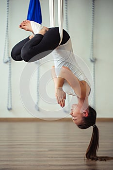 Lotus pose in aero anti gravity yoga. Aerial exercises