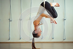 Lotus pose in aero anti gravity yoga. Aerial exercises
