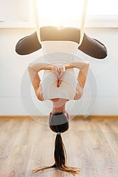 Lotus pose in aero anti gravity yoga. Aerial exercises