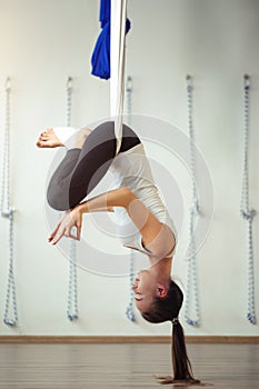 Lotus pose in aero anti gravity yoga. Aerial exercises