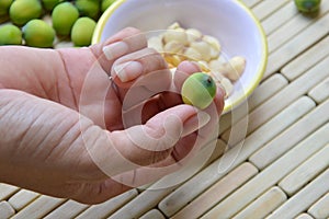 Lotus seed on finger picking