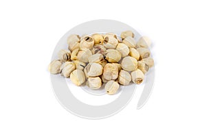 Lotus seed pile isolated over white background side view