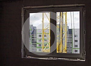 Loud construction site noise immission in opened one frame of white pvc window, view through