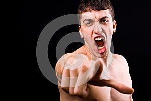 Loud scream of angry furious violent man photo