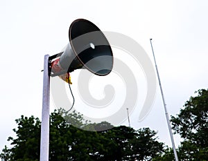 Loud Speaker On A White Pole Front View
