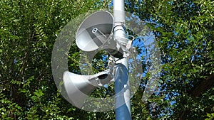 Loudspeakers fitted to make announcements on the street pole.