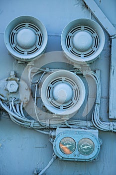Loudspeakers on a wall of a military ship