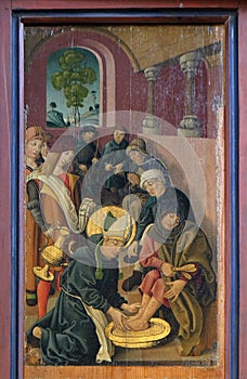 Louis is washing the feet of lepers and pilgrims