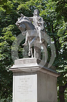 Louis XIII Statue in Place des Vosges Paris France photo