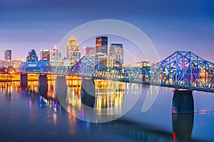 Louisville, Kentucky, USA downtown skyline on the Ohio River at dusk