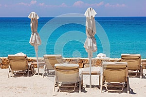 Lounge chairs on the beach in Sani, Greece photo