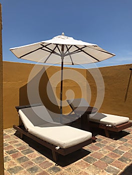 Lounge chairs and Shade Umbrella