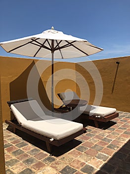 Lounge chairs and Shade Umbrella