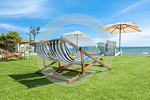 Lounge chairs with sun umbrella on a beach