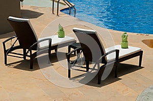 Lounge chairs by the swimming pool