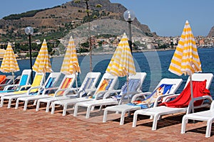 Lounge chairs and umbrellas