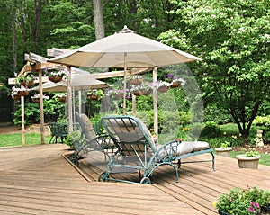 Lounge chairs under patio umbrella