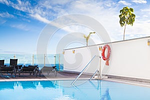 Lounge sunbeds neer swimming pool
