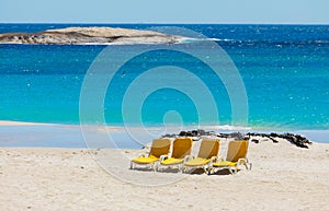 Lounger chairs on sandy beach in Cape Town