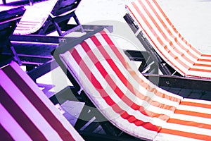 Loungers near the swimming pool on a summer day