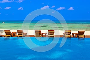 Loungers and pool on Maldives beach