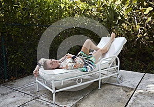Lounging on lounge chair in the tropics