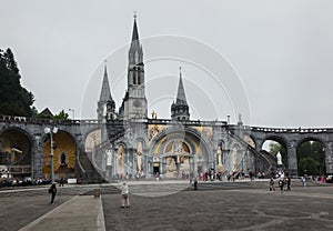 Lourdes, France, 24 June 2019: Front of the richly decorated entrance to the Rosary Basilica in Lourdest