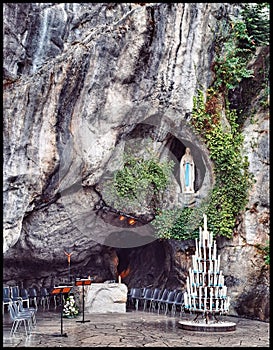 Lourdes Grotto: Candles and Virgin Mary Statue