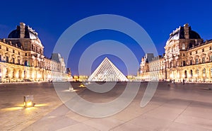 Louvre palace and pyramid at night, Paris, France