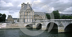The Louvre and pont royale bridge,paris photo