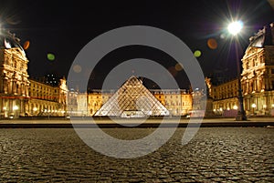 Louvre pyramid museum France by night