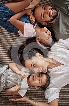 Love, above and happy relax family having fun, bond or enjoy quality time together in home living room. Smile, laugh and
