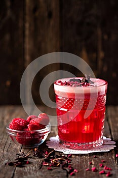 Love Affair cocktail alongside with fresh berry fruit