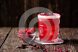 Love Affair cocktail alongside with fresh berry fruit