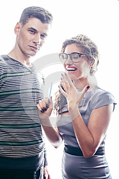 Love affair at work, young pretty couple, man and woman together isolated on white background, office clerk, secretary