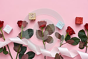 Love is a in the air. Red roses with cute colorful gist boxes and white ribbon on the top