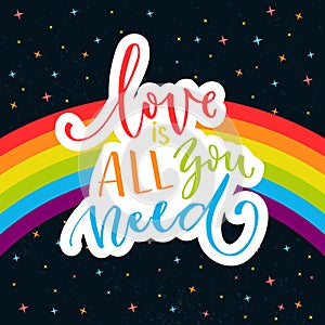 Love is all you need. Romantic quote on rainbow parade flag at dark sky with stars. Gay pride saying for stickers, t
