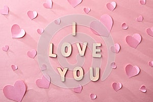 Love background with hearts cutouts and i love you message